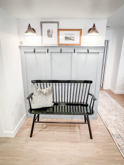 Welcome area with bench and coat hooks.