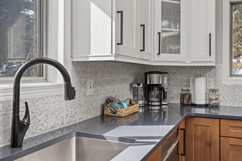 Help yourself to the complimentary tea, coffee and snacks.