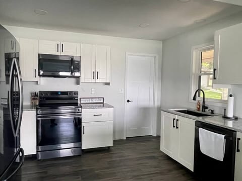 Brand new quartz countertops and stainless appliances.