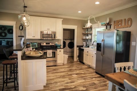 Open kitchen with seating for four at the bar