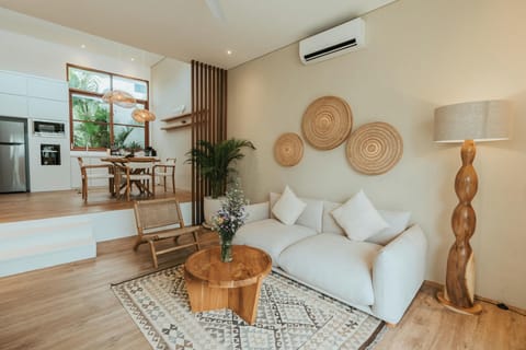 Bright living space with natural light and stylish décor elements.