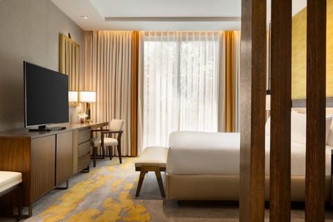 Elegant unit with a King bed, mini-fridge and flat screen TV