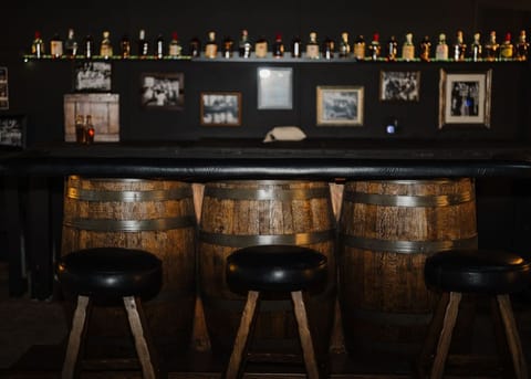 Prohibition-era-themed Speakeasy bar & lounge with vintage whiskey barrels