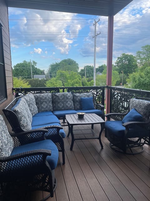 Spacious deck with ceiling fan and grill