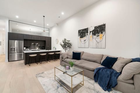 Bright living room inviting you to settle in & relax.