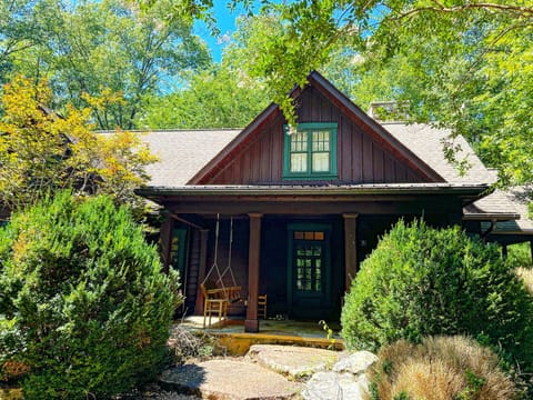 Front of house. Porch swing and 4 rocking chairs. So private!