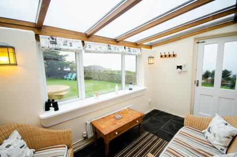 Tal y Gaer Cottage conservatory with views over the garden