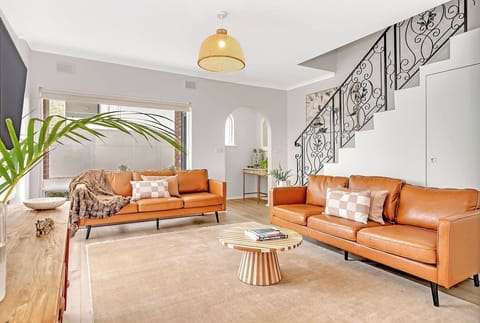 Contemporary furnishings and a stylish leather sofa make the living area a chic and inviting space.