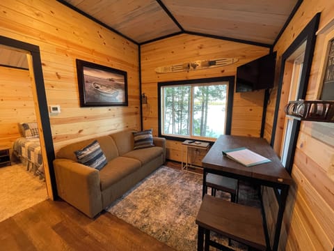 Living room, dining area with beautiful lake view.  Smart TV and Wifi