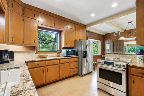Fully stocked kitchen with drip and Keurig coffee makers, electric stove and oven and all dishes and utensils that you'll need.