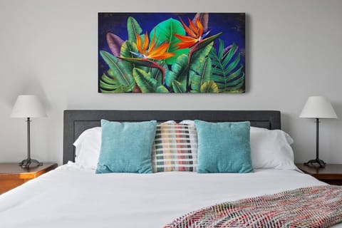 Spacious queen size bed w/ocean decor
