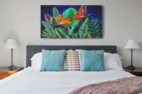 Spacious queen size bed w/ocean decor