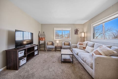 A welcoming living room featuring a sleek TV setup, ideal for relaxing evenings and entertaining guests with favorite shows and movies.