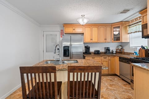 Additional seats at the kitchen island.