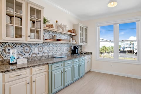 Featuring stone counters and stainless appliances throughout