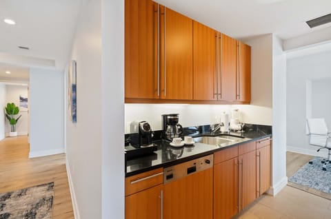 Well-Designed Kitchen of the Condo in Miami Florida - Plenty of storage  - Availability of all kitchen accessories - Elegant lighting - Sufficient space to walk and work according to your ease