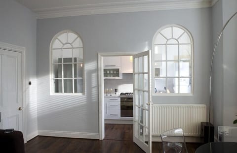 Entrance to kitchen area highlights the high ceilings