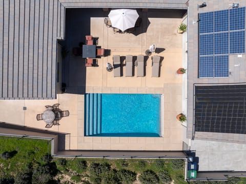 Elegant lounge seating and lush landscaping complete this resort-style oasis.