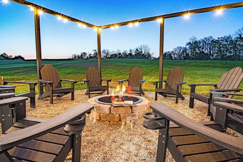 Gather around the fire pit under the twinkling lights and starry sky!