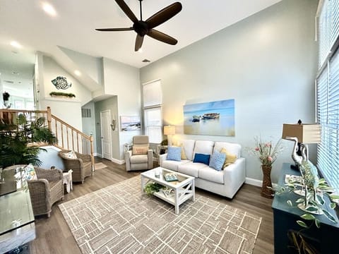 Beautifully decorated living room with half bath and access to garage.