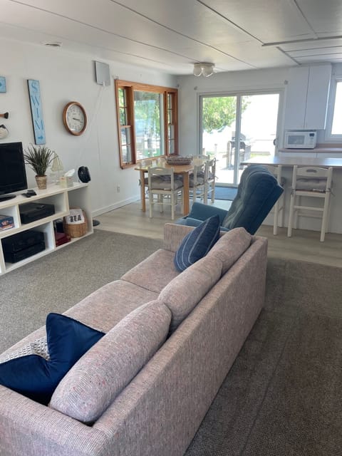 LIVING ROOM:  The cottage has a very comfy and cozy living room with a sofa, loveseat, comfy chair, and television.