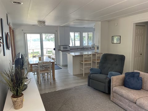 LIVING ROOM:  The cottage has a very comfy and cozy living room with a sofa, loveseat, comfy chair, and television.