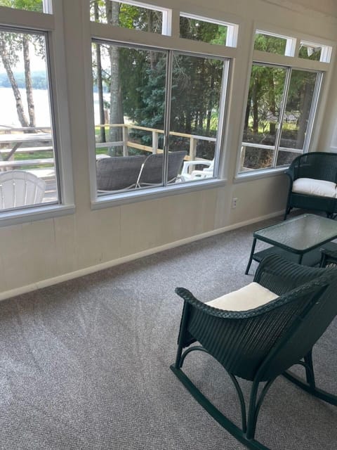 PORCH:  The cottage has a beautiful enclosed porch with comfy seating and great views of the lake!
