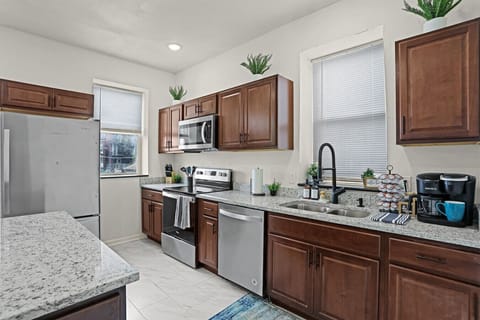 Elevate your cooking experience in this meticulously designed and fully equipped kitchen.