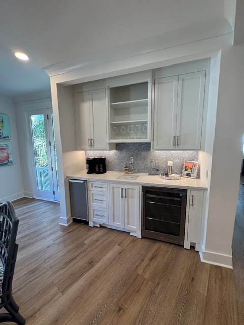 Wet bar with wine fridge, ice maker and coffee bar
