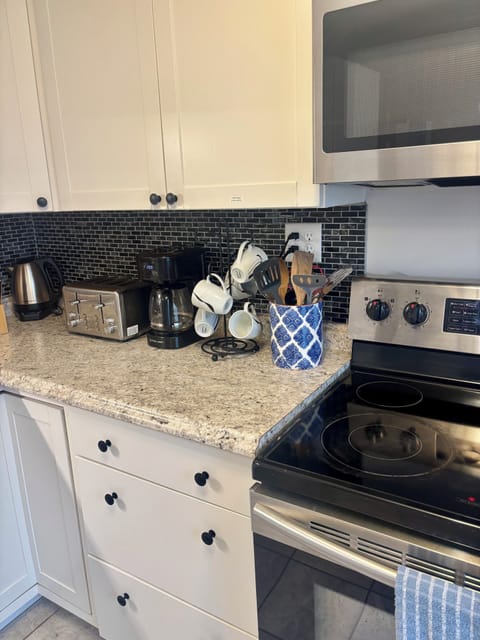 coffee, creamer, seasoning basics in cabinet