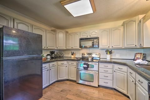 Our kitchen comes fully stocked with all the essentials you need for meal preparation, including dishware, glassware, utensils, coffee filter packs, creamer, sugar, and a complete set of baking and cookware.