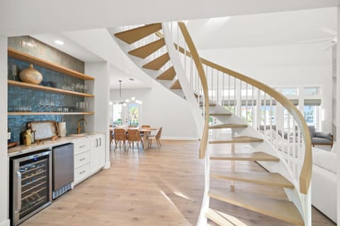 Front Entrance with Spiral Staircase and Wet Bar