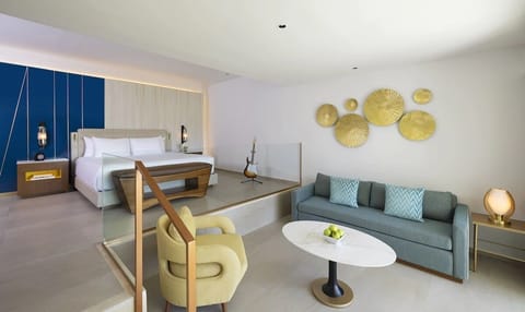 Spread out in an airy suite with lounge seating nearby.