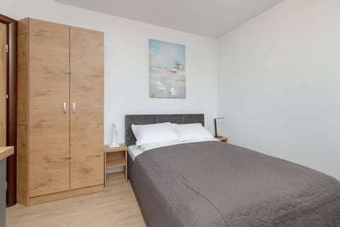 Cosy space of the studio with sleeping area and closet.