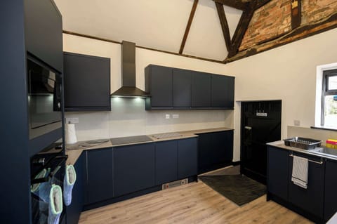 You'll find a kettle, toaster, microwave, double oven, electric hob, and washing machine