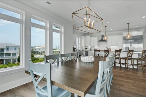 Bright dining area with large wooden table
