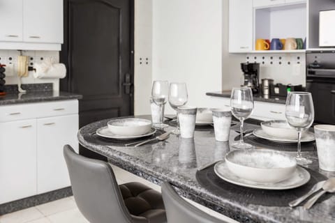 Enjoy meals together in a sleek dining space designed for comfort and style.