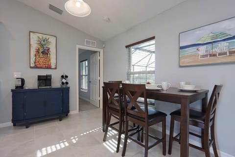 Inviting dining space featuring a cozy table and coffee bar, ideal for relaxed meals or casual gatherings