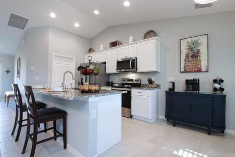 Bright, airy kitchen with stainless steel appliances, perfect for entertaining and everyday living