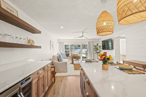 The open-concept kitchen and living area create a bright, airy space, enhancing the unit's spacious feel