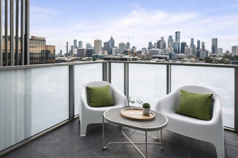 Enjoy a drink on your private balcony with great skyline views