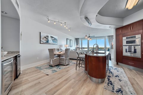 Imagine yourself in this high-end luxury condo, where the open layout flows effortlessly from the well-equipped kitchen to the spacious living and dining areas, all while being just a stroll away from Flora-Bama.