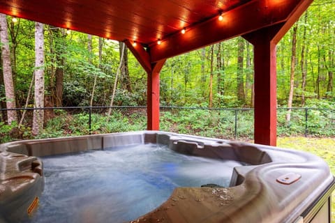 The private hot tub is fully covered and also includes LED lights.
