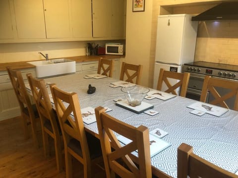 The fully equipped kitchen with farm house table
