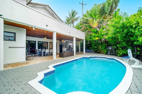 Villa exterior with a large, beautiful pool.