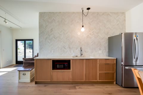 Family room kitchenette and second sofa which makes into a queen bed.  