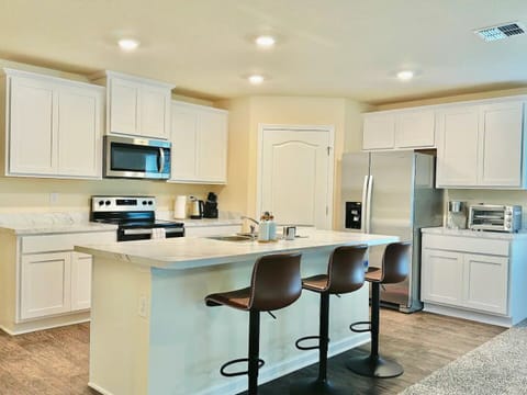 Open concept kitchen is fully stocked