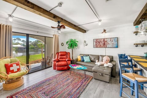 Lagoon Front Living Area with Full Size Sleeper Sofa, Queen Size Murphy Bed, Flat Screen TV and Private Patio Access