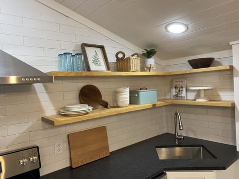 Open shelves in our kitchen with granite countertops & full size appliances!