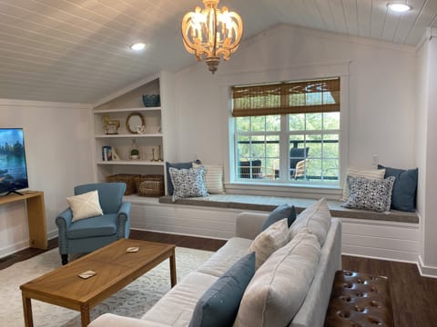 You'll enjoy a cozy window seat in our spacious living room!